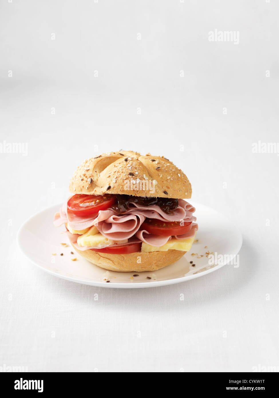 Ham and tomato sandwich on plate Stock Photo