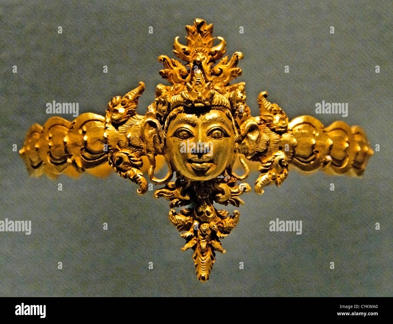 Arm Band with Man's Head Central or Eastern Javanese period 10th century  Indonesia Java Gold 5.4 cm Stock Photo