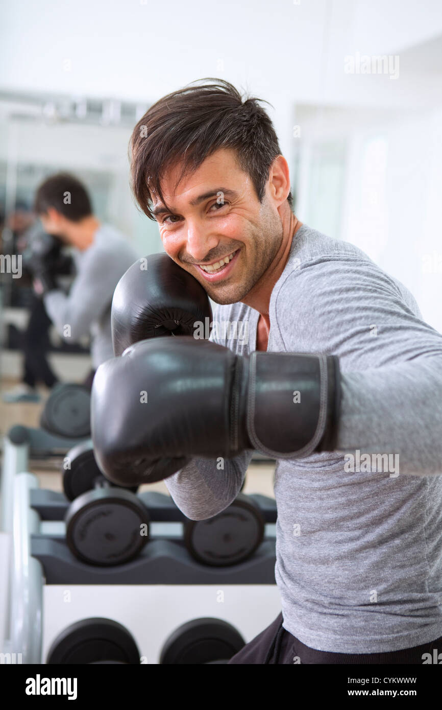 Boxer wearing boxing gloves in gym Stock Photo Alamy