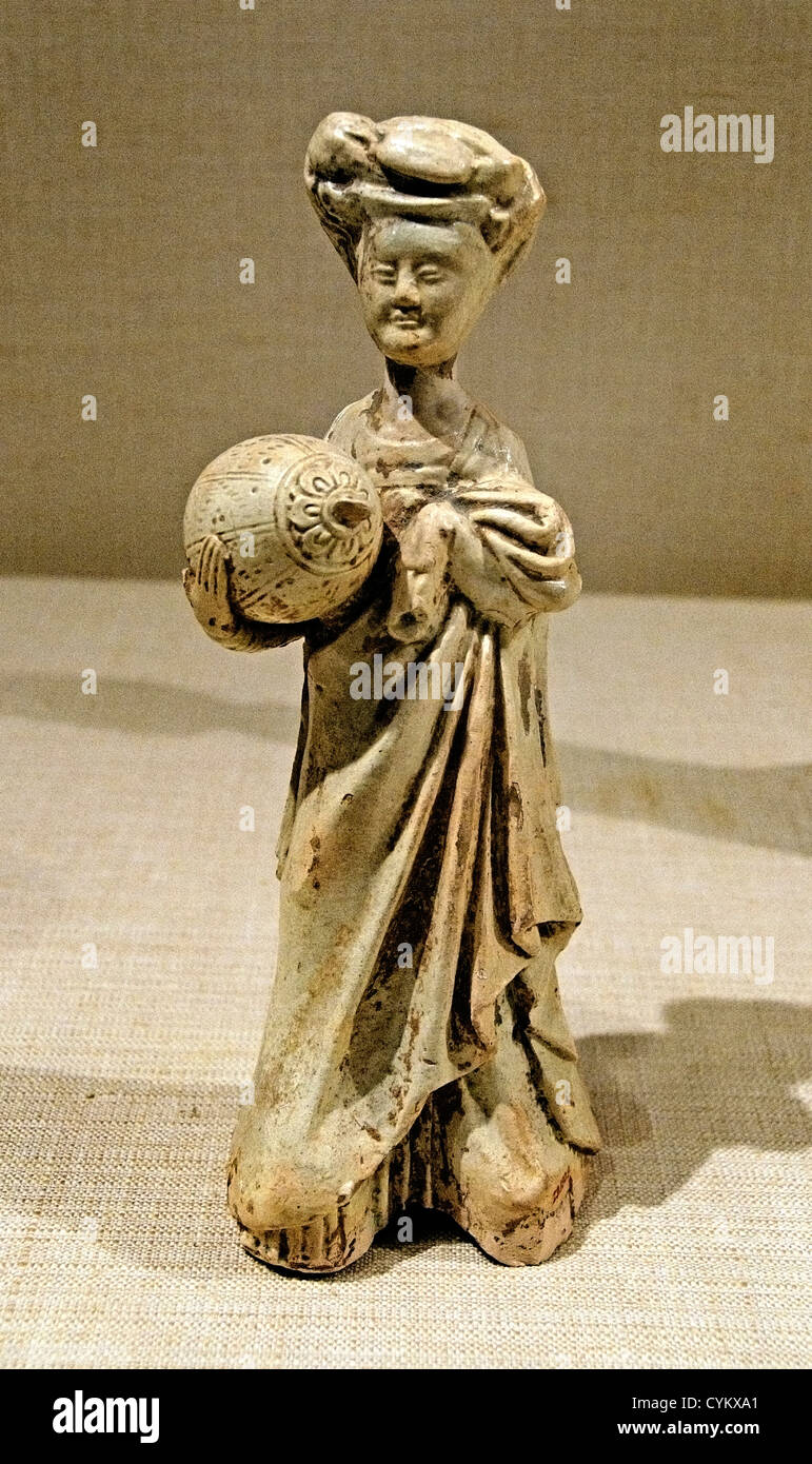 Female Attendant Carrying a Pillow Sui dynasty 581–618 China Glazed earthenware with pigment 24 cm Stock Photo