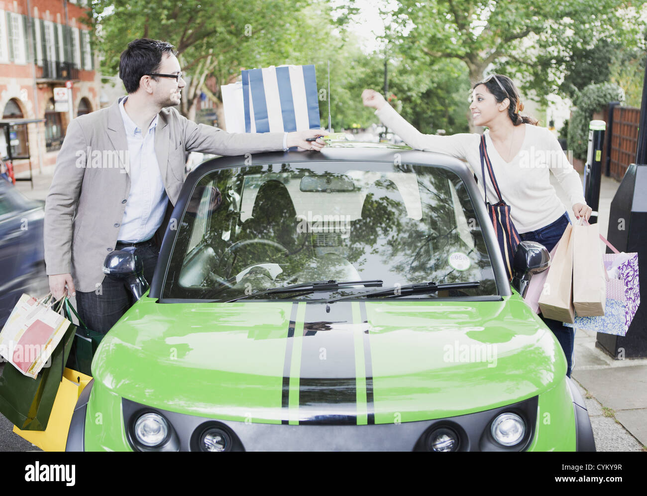 Couple loading shopping bags in car Stock Photo Alamy