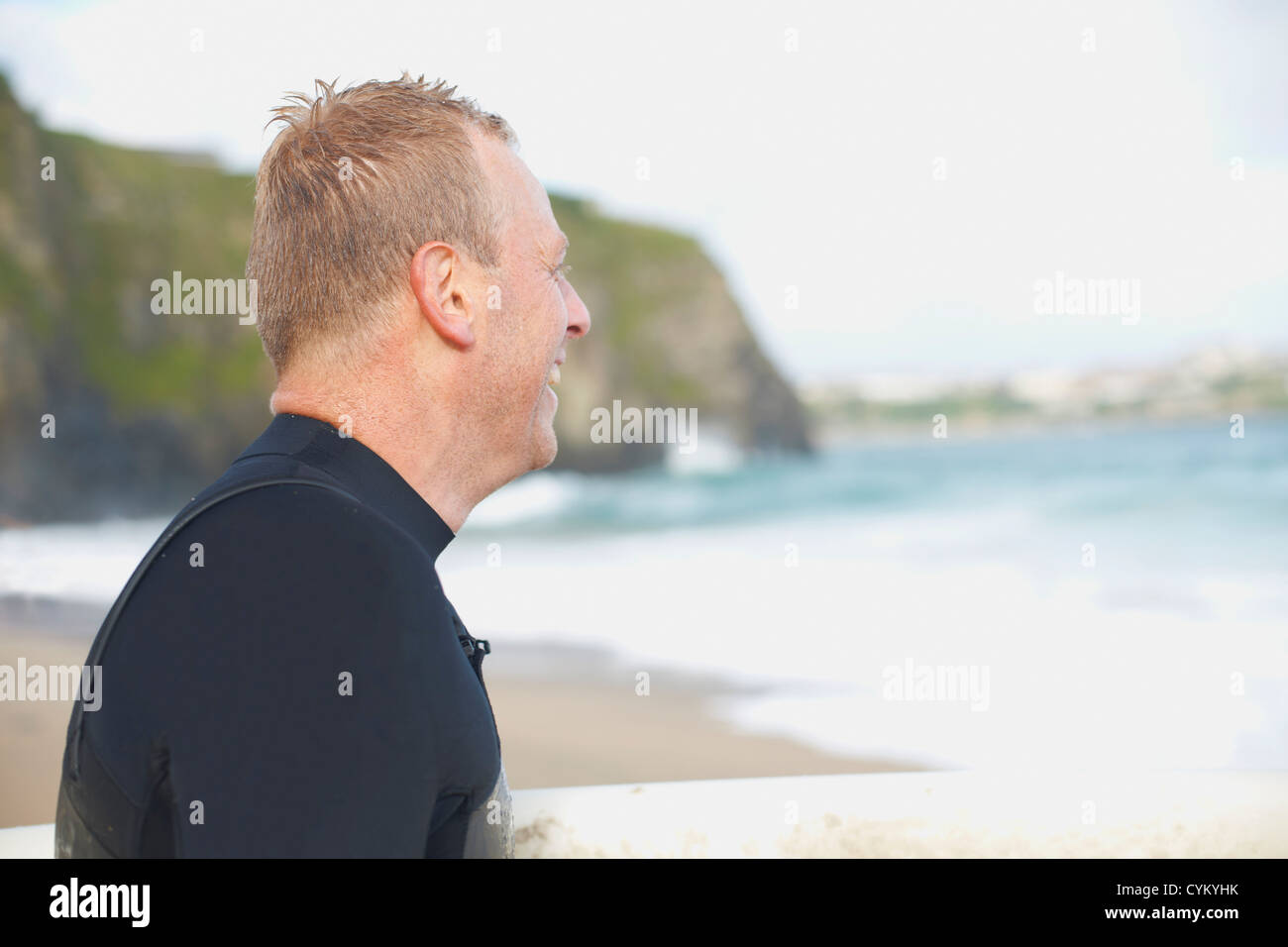 Smiling surfer wearing wetsuit hi-res stock photography and images - Alamy