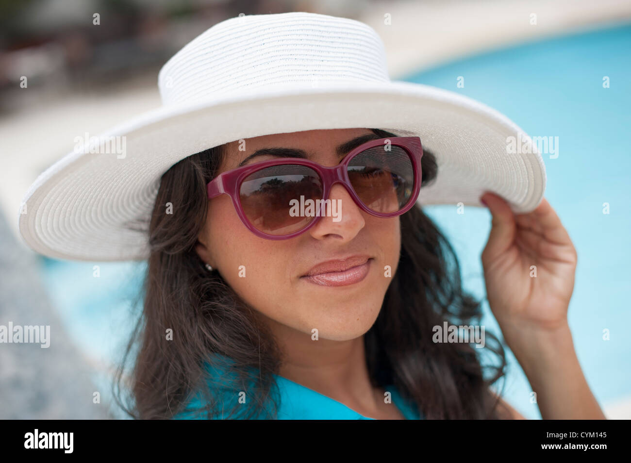 Smiling woman wearing sunhat outdoors Stock Photo