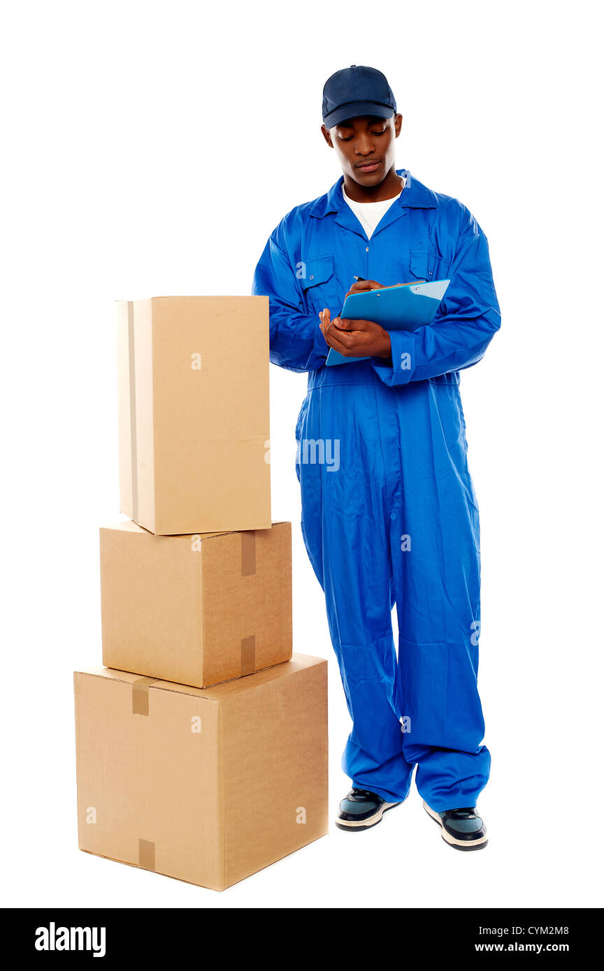 Delivery boy at work. Kindly accept your goods. All on white background Stock Photo