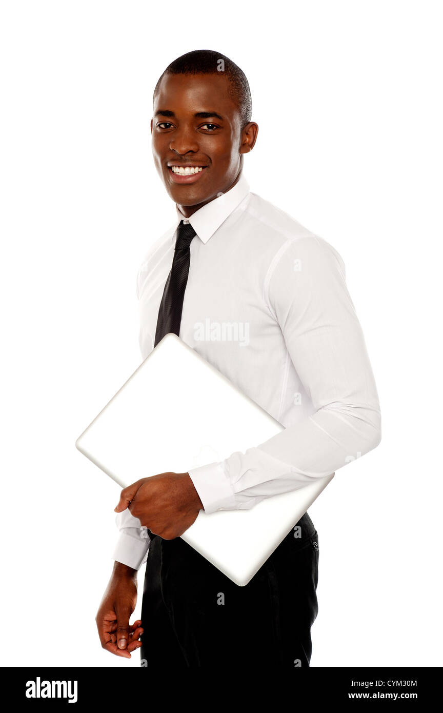African businessman carrying laptop and looking at camera Stock Photo ...