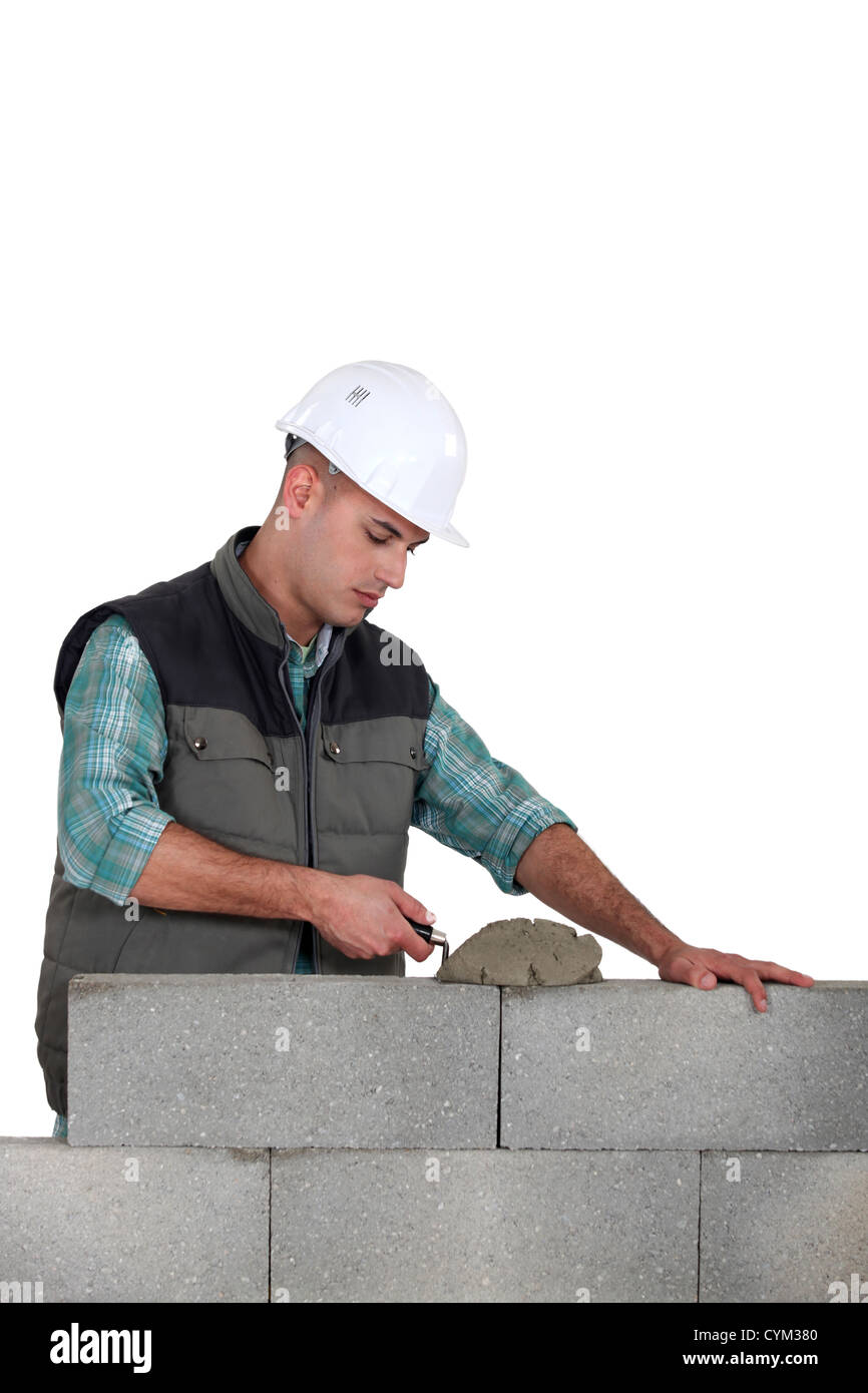 Man spreading mortar Stock Photo Alamy