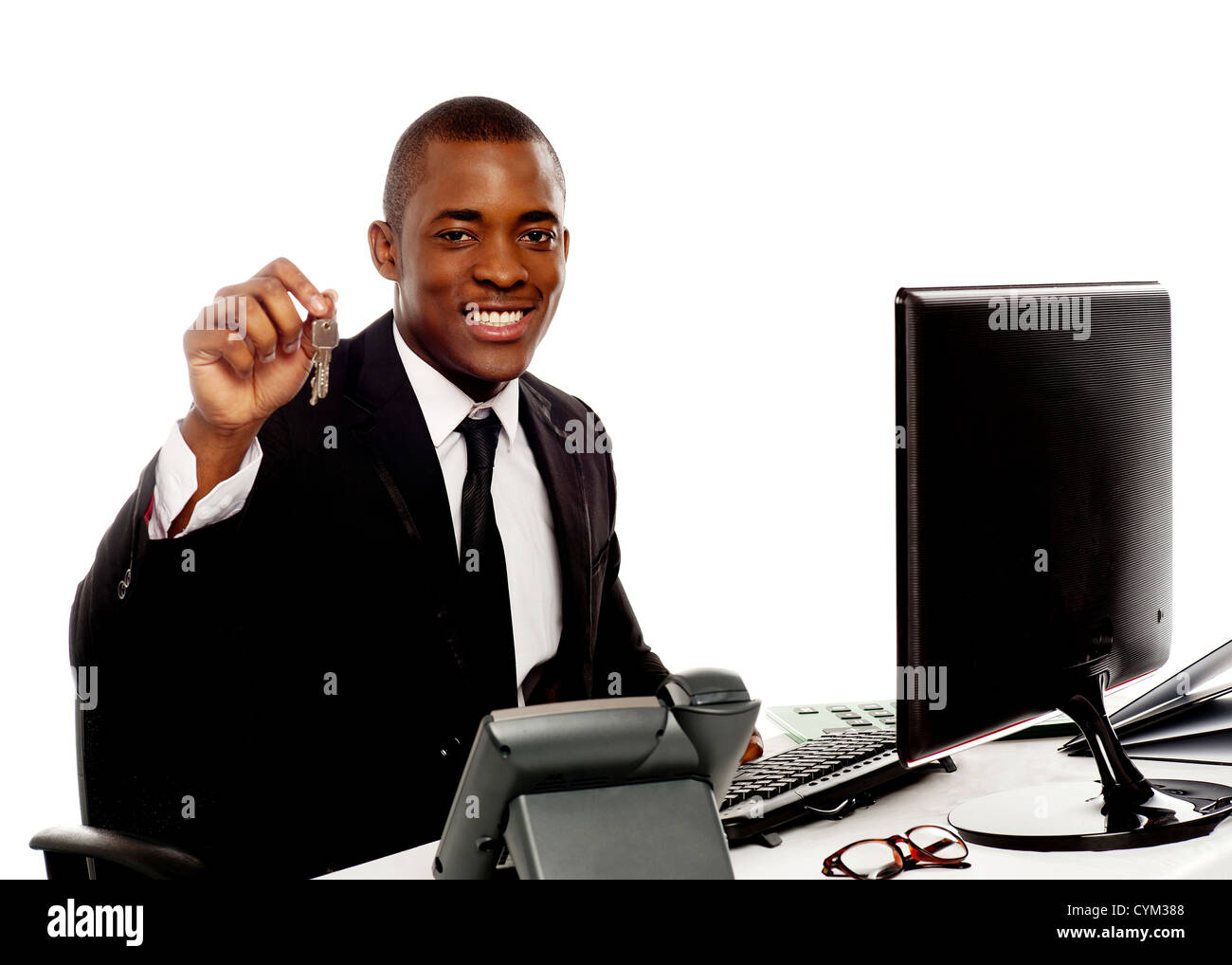 Manager showing office keys to camera isolated against white background ...