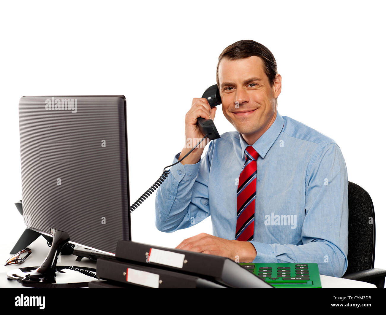 Businessman talking on phone, handling clients while working on ...