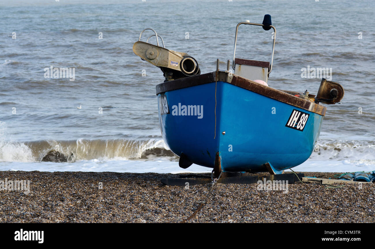 fishing boat on shingle beach Stock Photo - Alamy