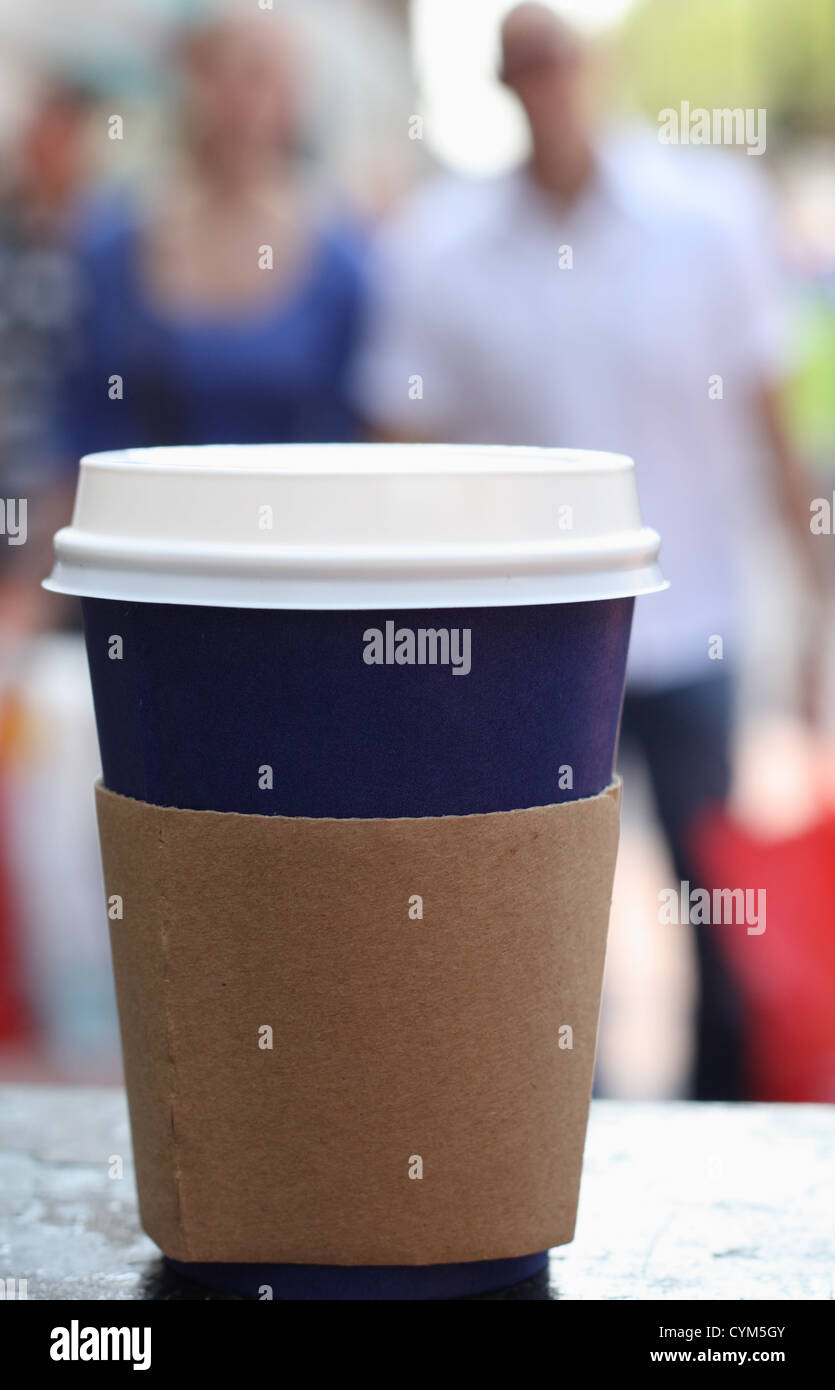 blue coffee cap with lid on a street people background Stock Photo