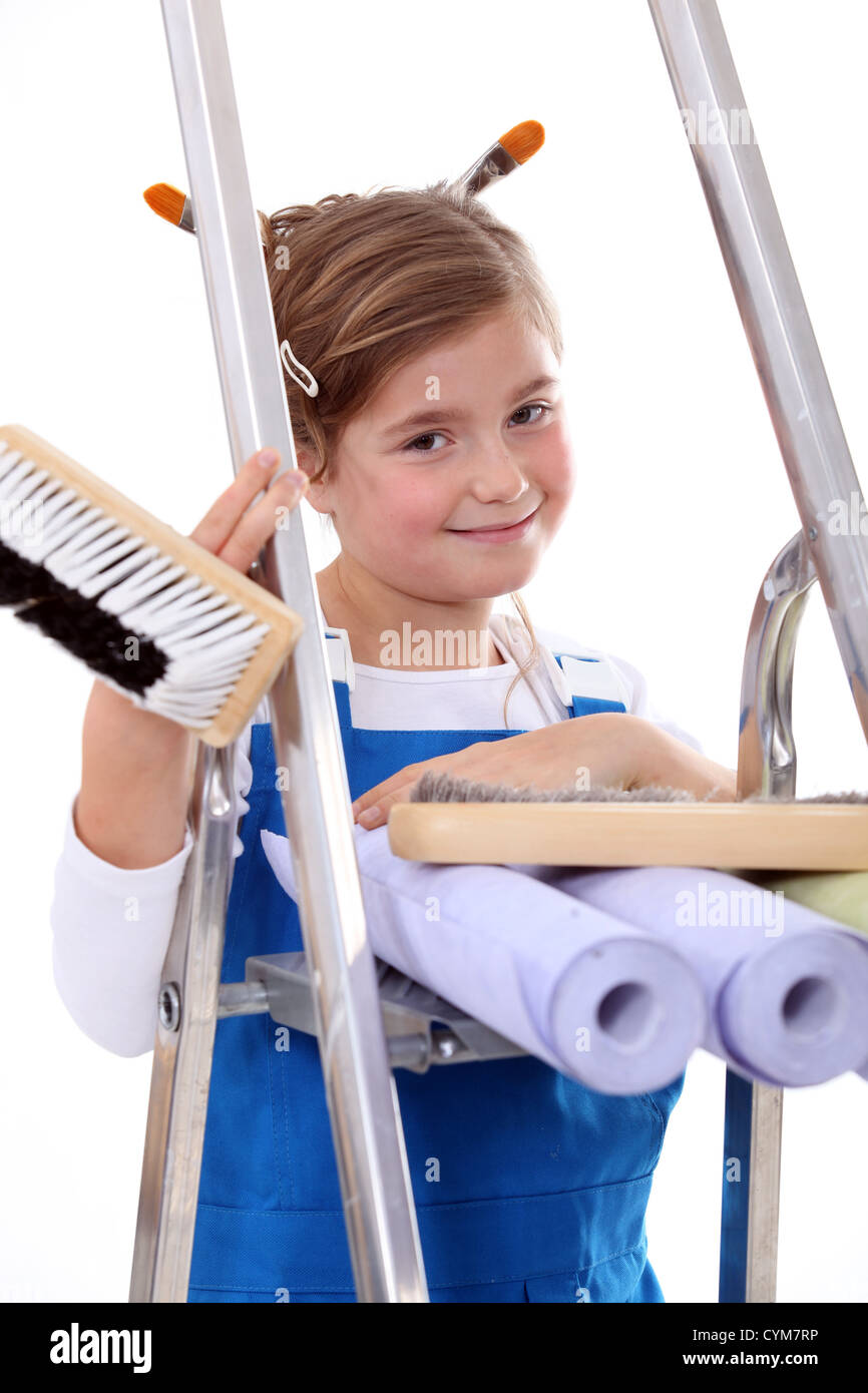 Little girl with step ladder and wallpaper Stock Photo Alamy