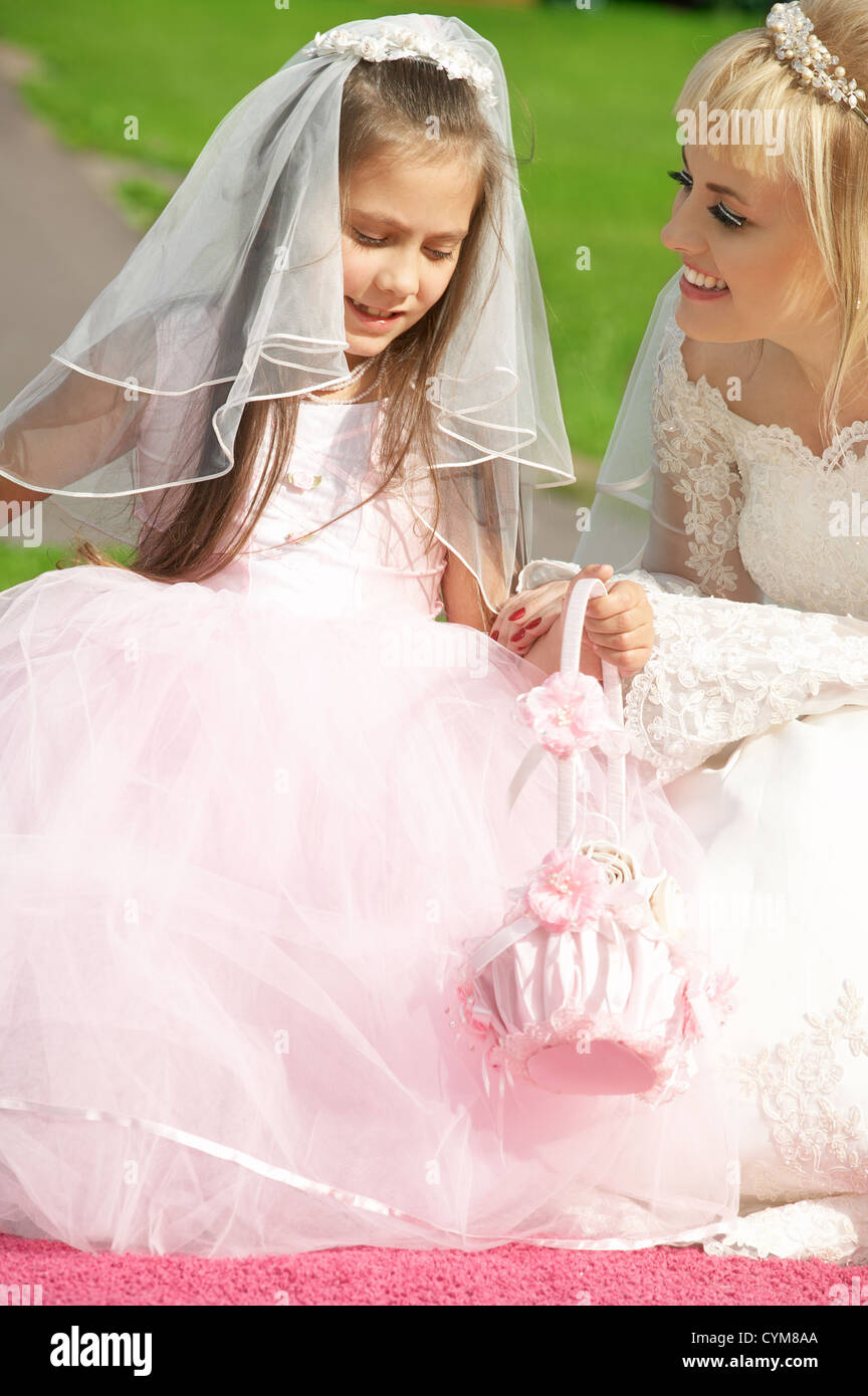 picture of happy bride and little bridesmaid Stock Photo - Alamy