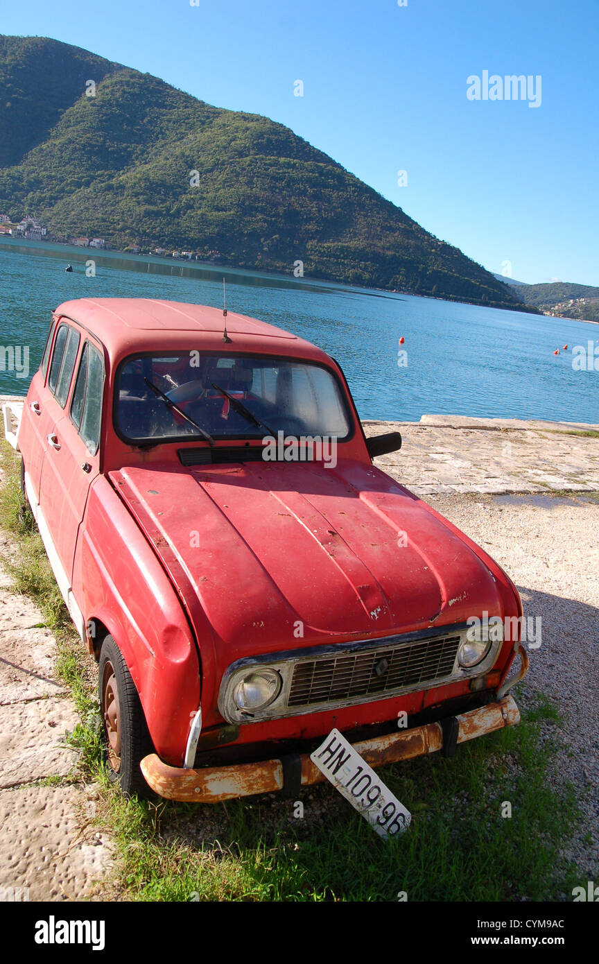 Abandoned Red Citroen Car in Perast on The Bay of Kotor, Montenegro Stock Photo