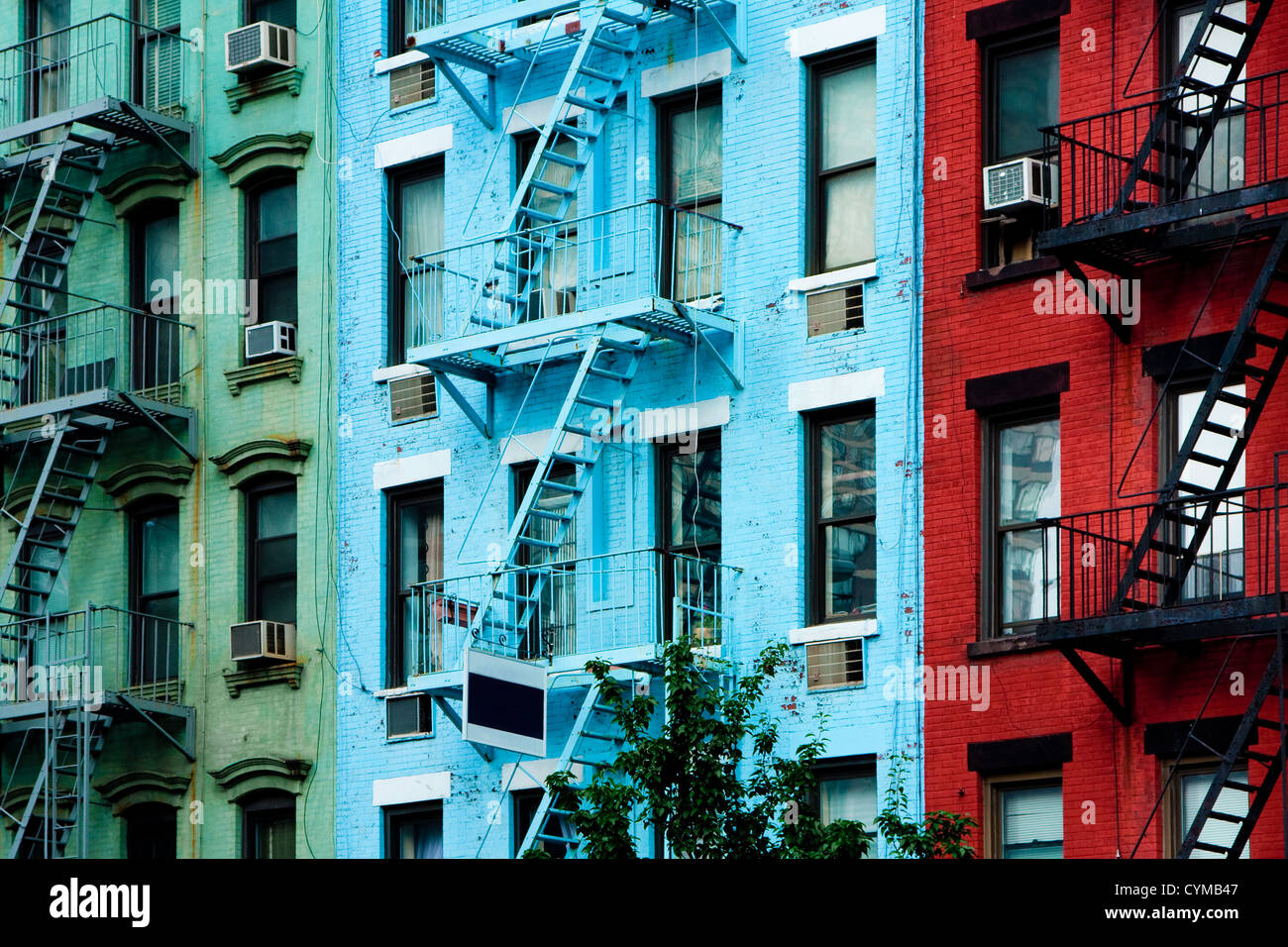 Colorful apartment buildings with fire escapes Stock Photo