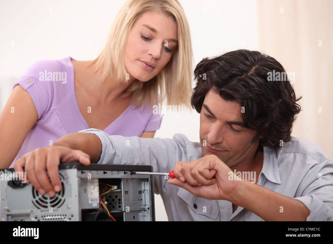 Man fixing a computer Stock Photo Alamy