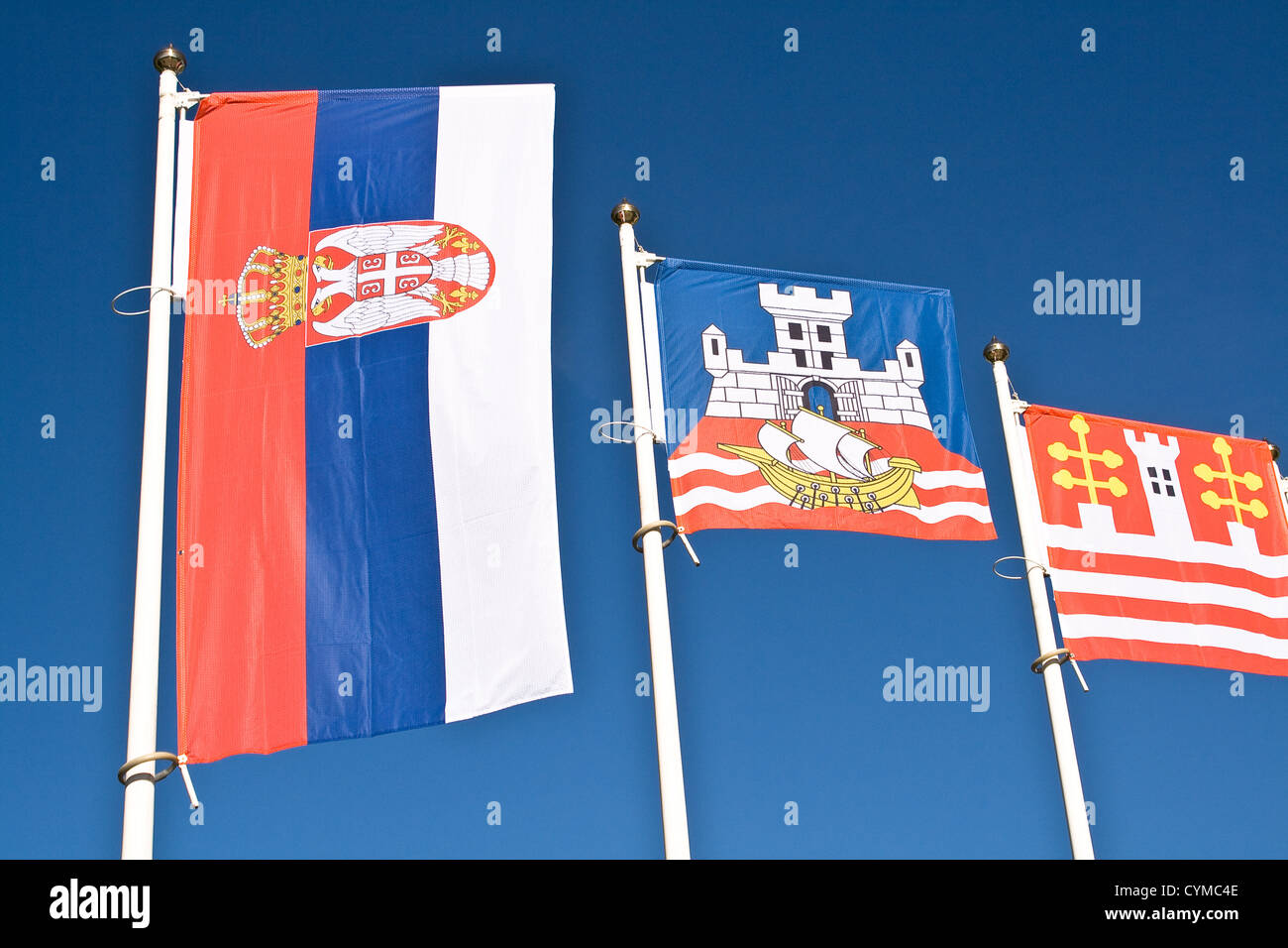 Serbian and Belgrade flag against blue sky Stock Photo