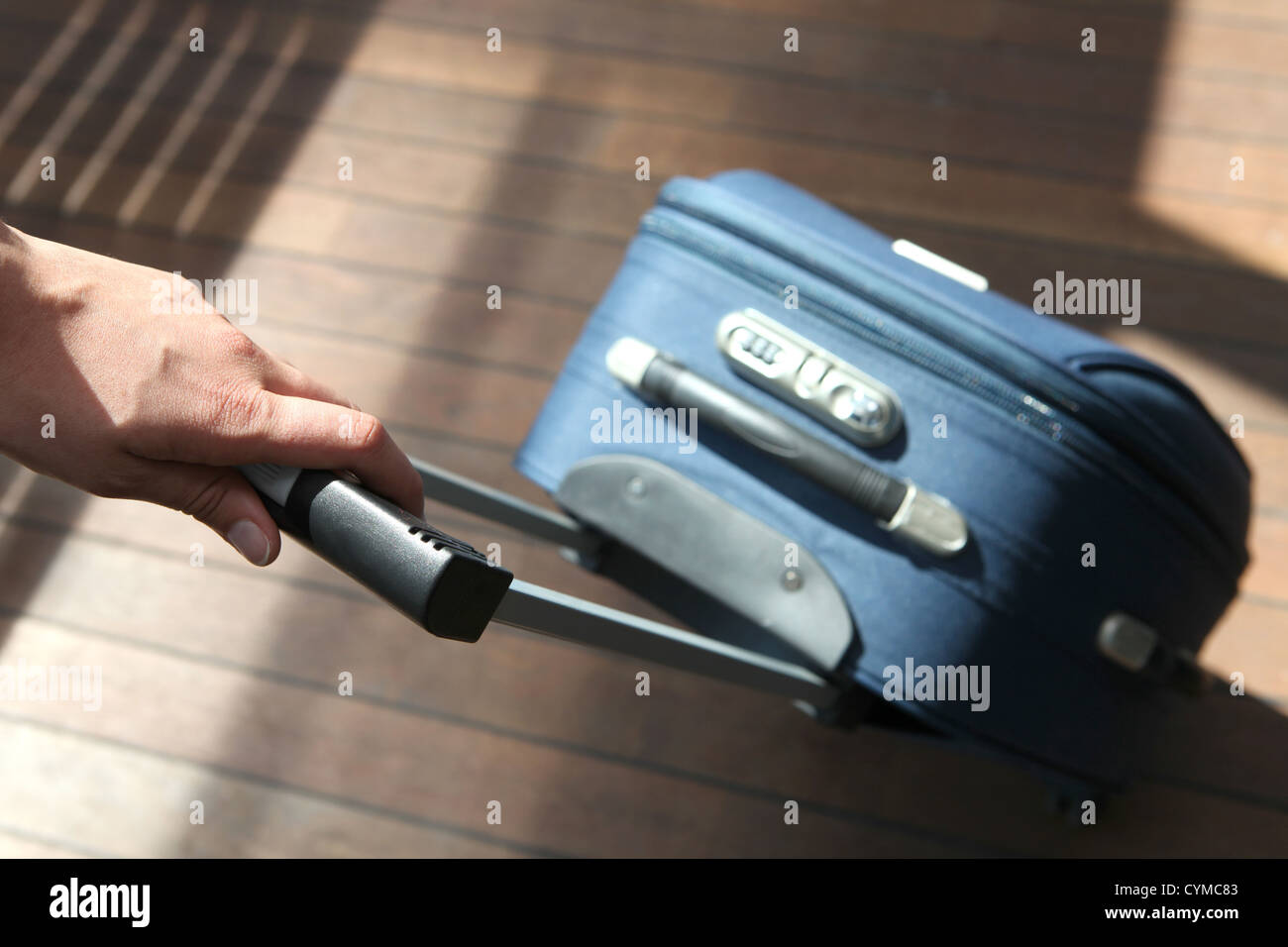 Pulling a suitcase Stock Photo Alamy