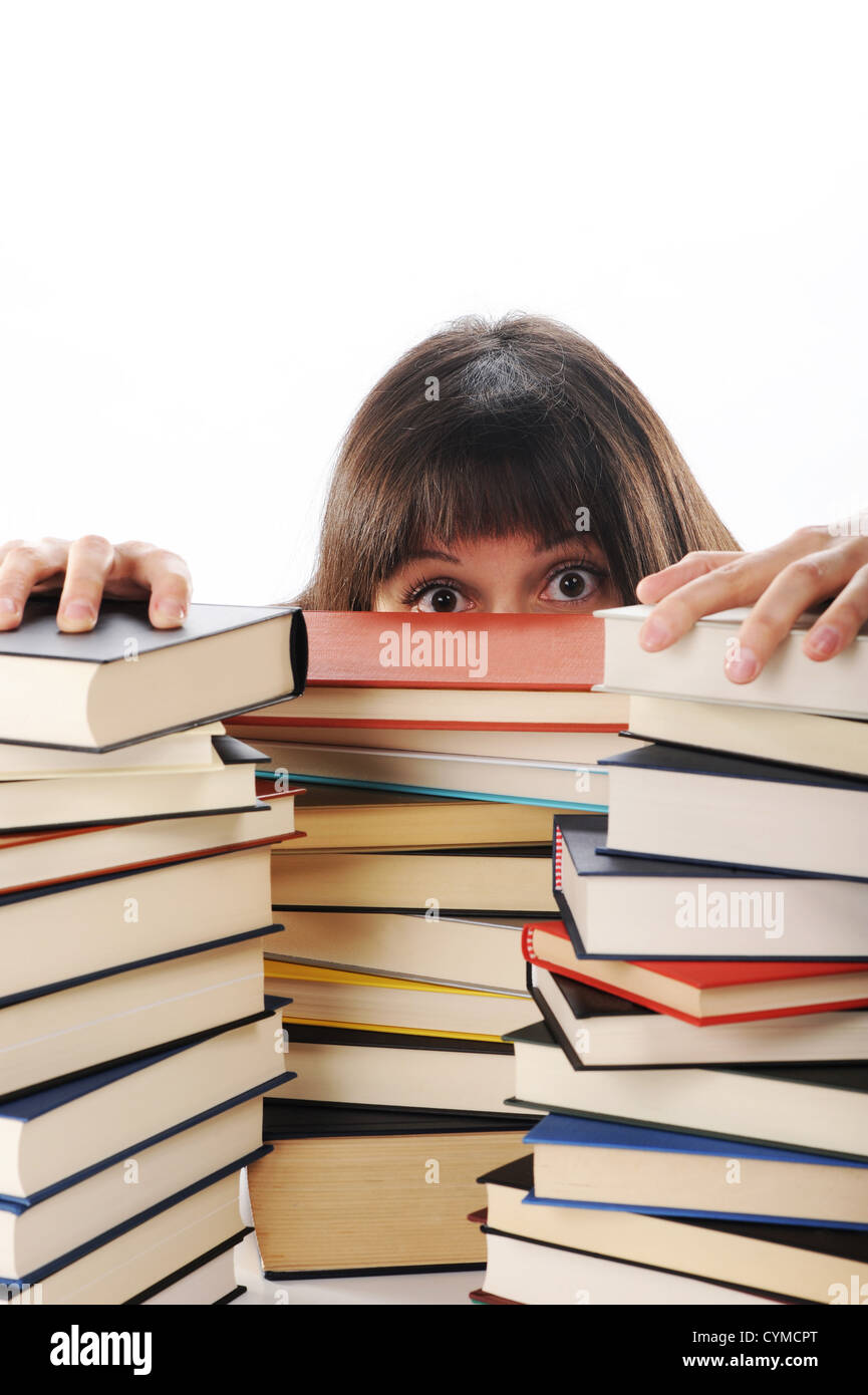 young woman behind a big pile of books Stock Photo - Alamy