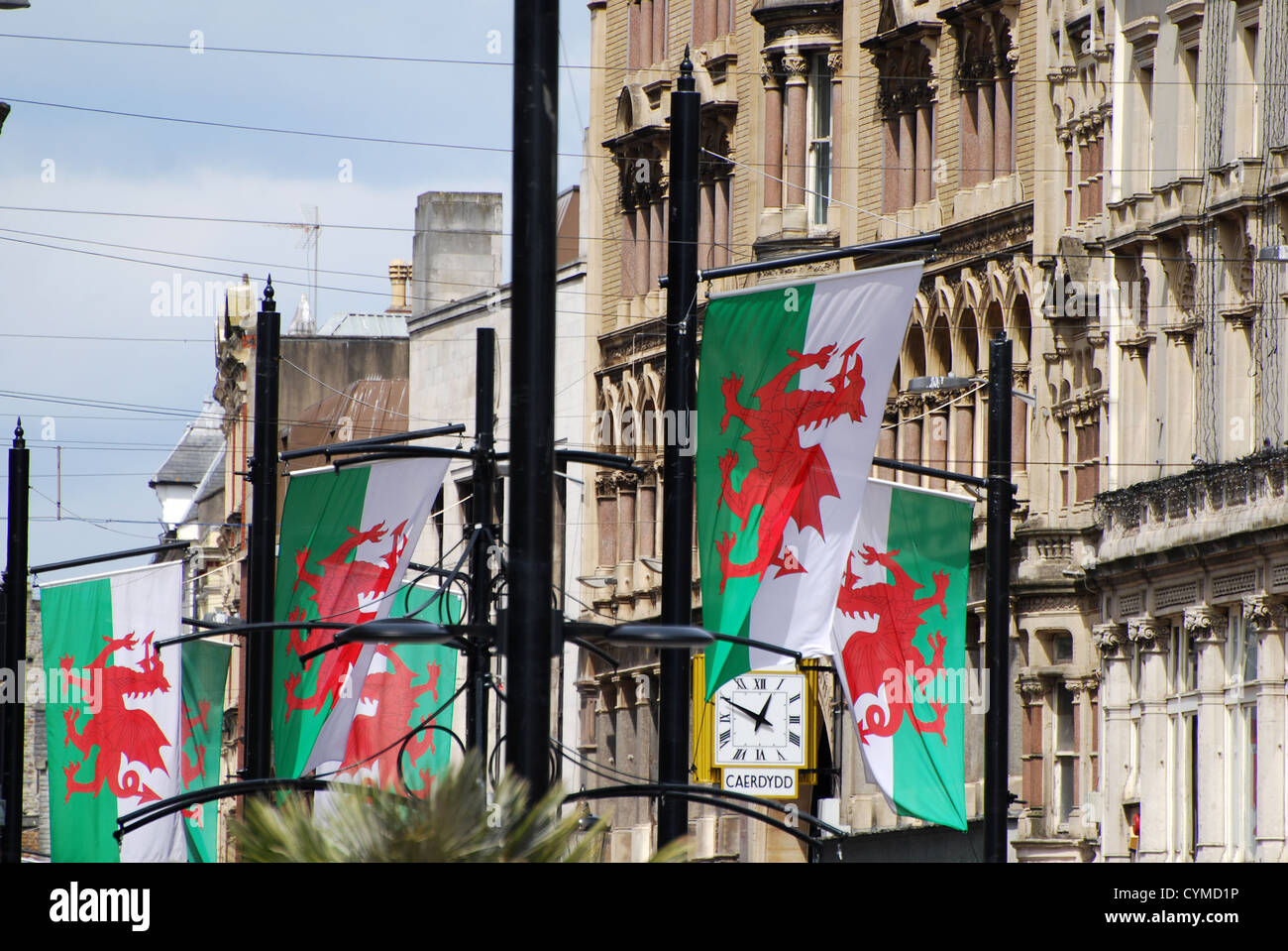 welsh flags and caerdydd clock number 3259 Stock Photo