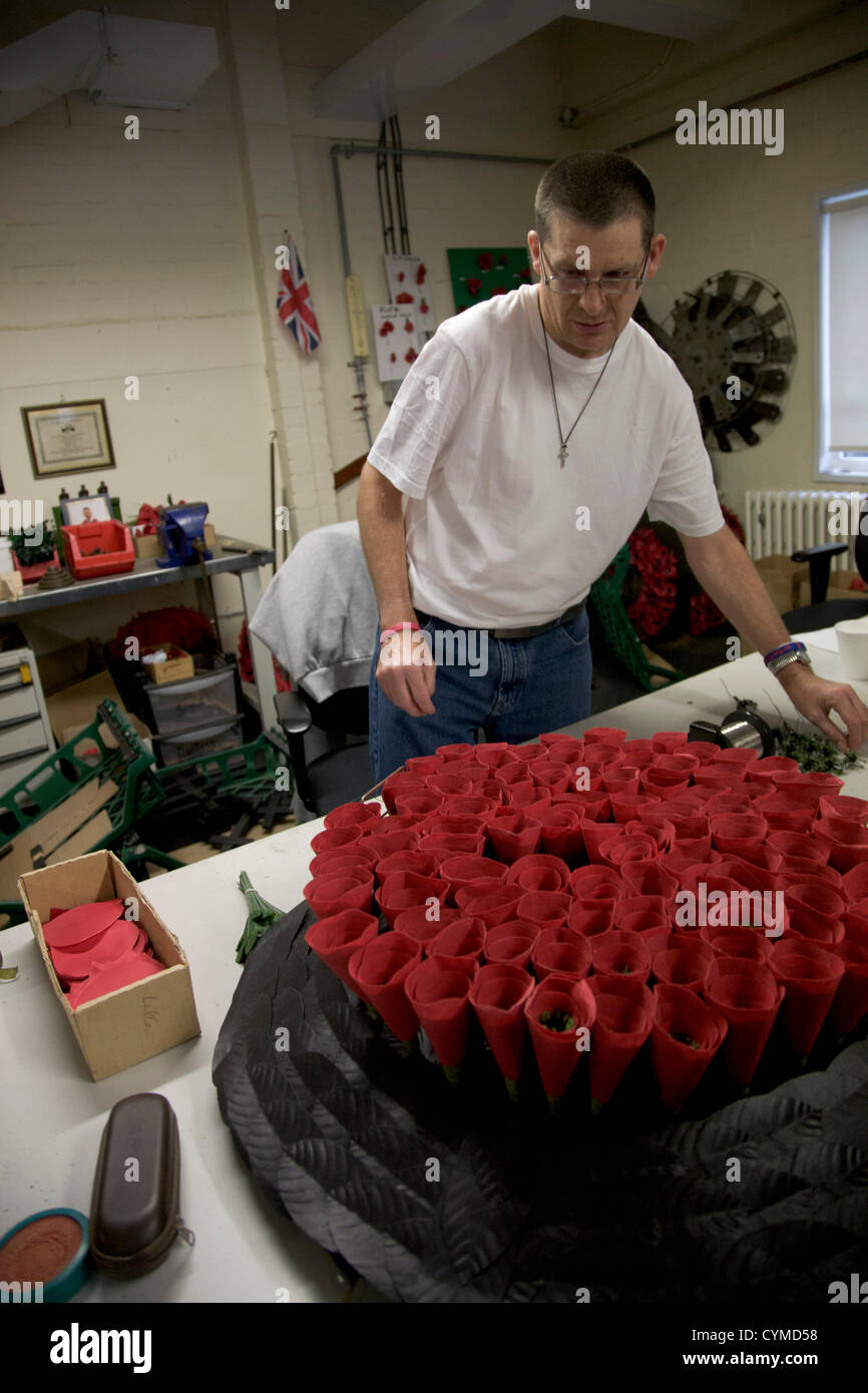 7th November 2012. London UK. A worker making a wreath for Her Majesty
