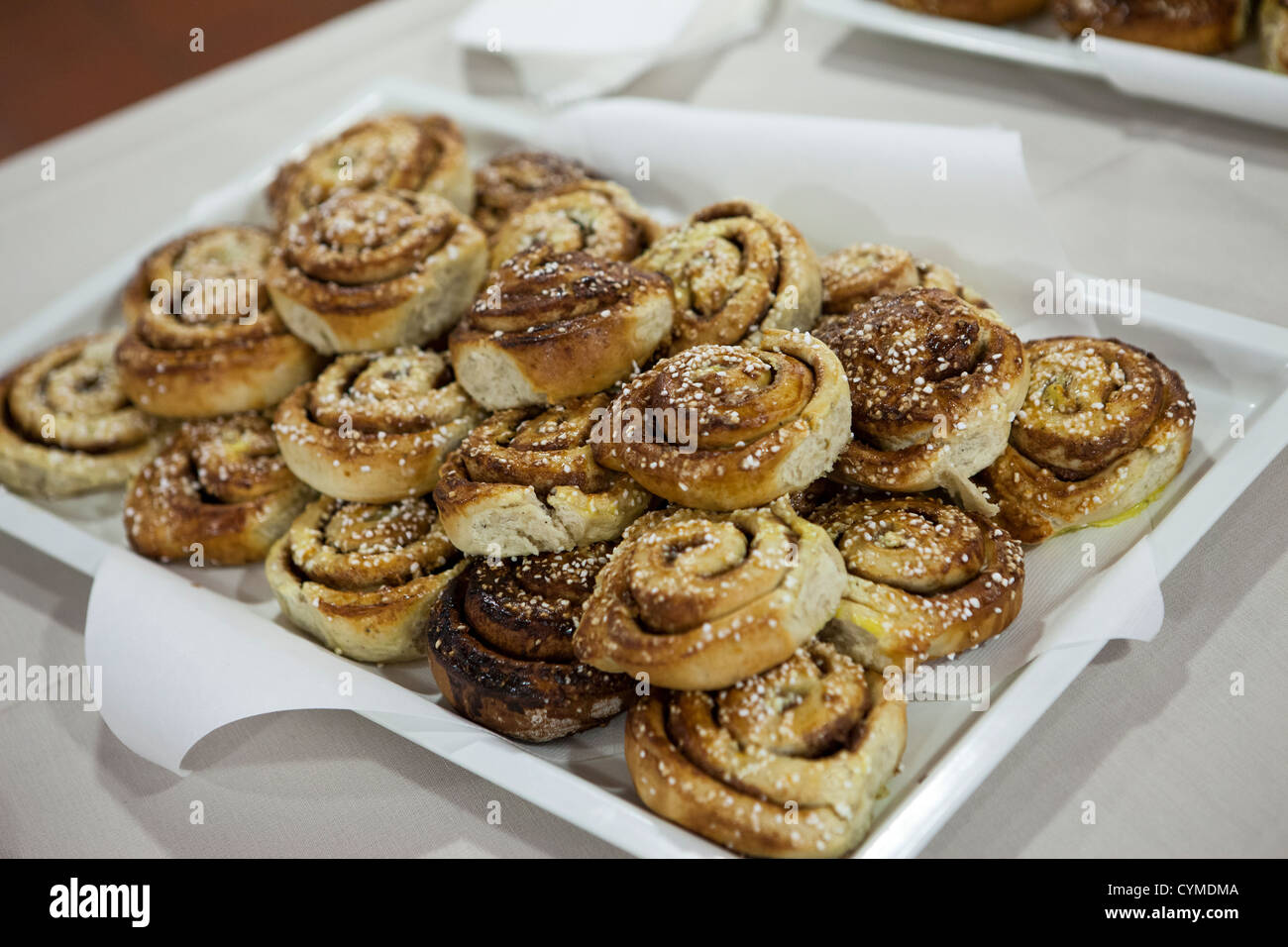 Plate with lots of cinnamon buns Stock Photo
