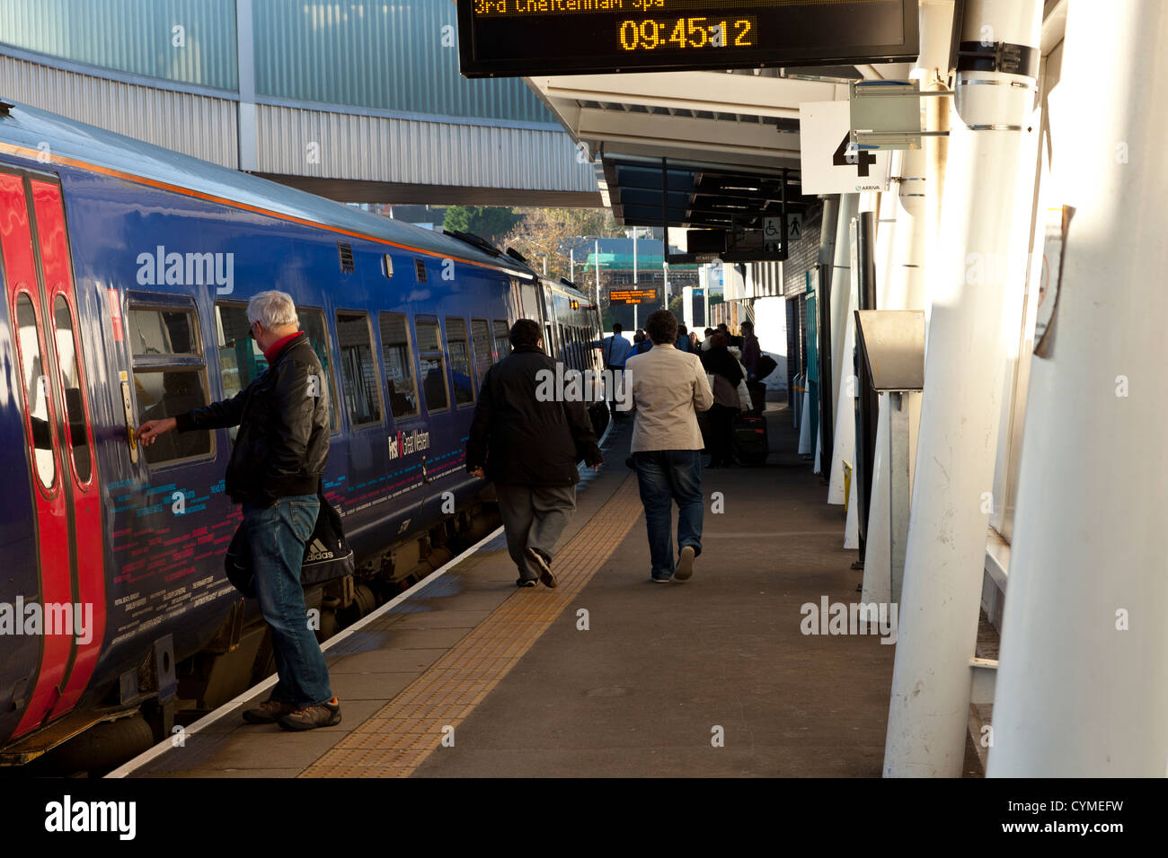 Commuters and passengers boarding a train at Newport railway station