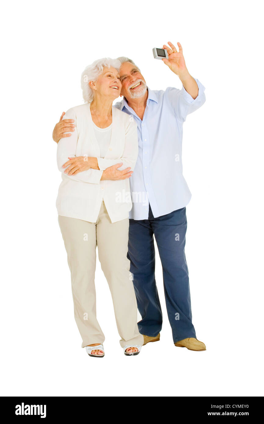 elderly couple taking photograph Stock Photo