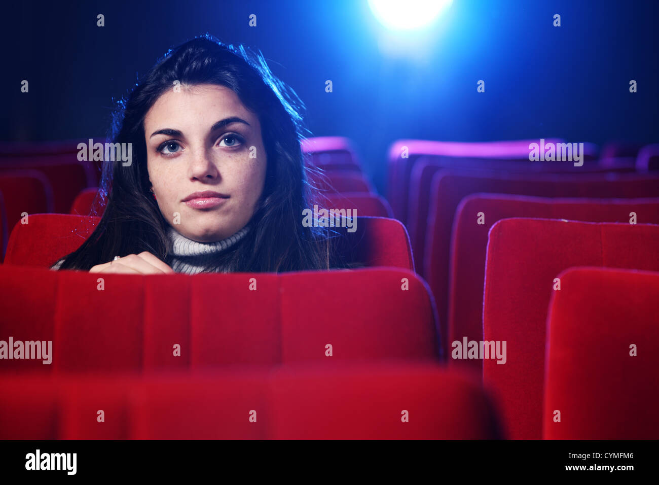 portrait of a pretty young woman at cinema Stock Photo
