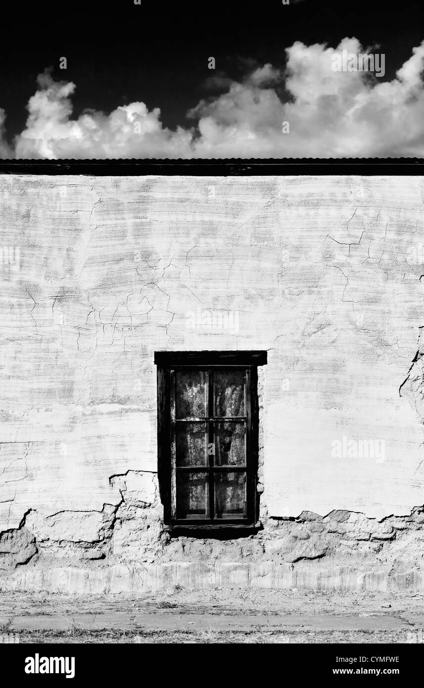 Adobe Building Windows Window with curtains on a boarded and abandoned adobe building Stock ...