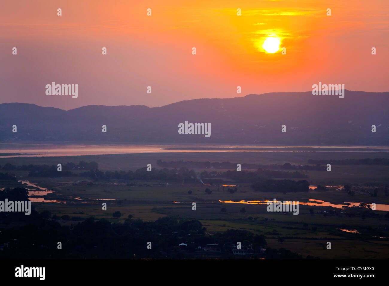 Sunset from MANDALAY HILL with view of the IRRAWADDY RIVER - MANDALAY, MYANMAR Stock Photo