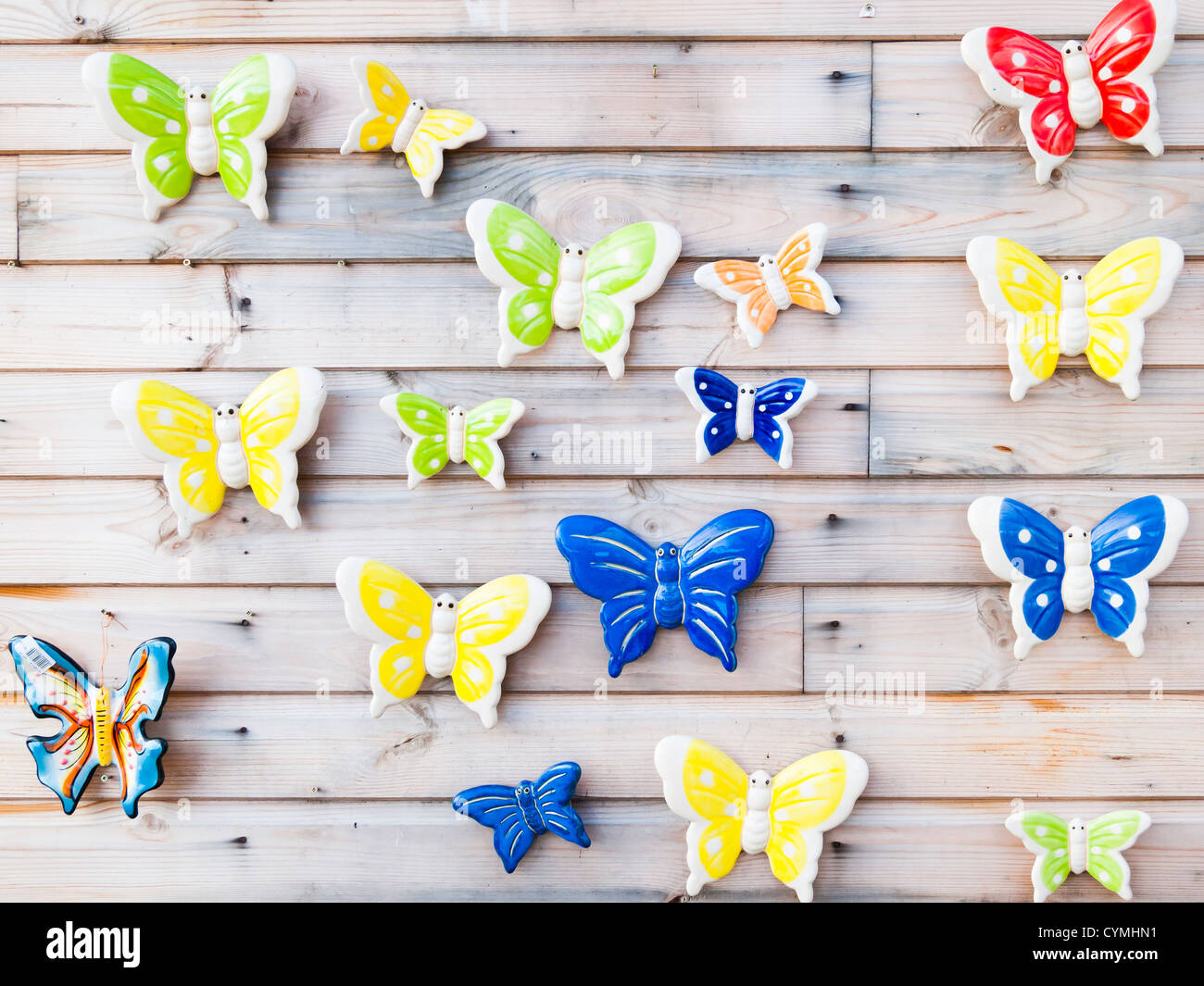 Ceramic butterflies for wall decoration for sale in a garden centre Stock Photo