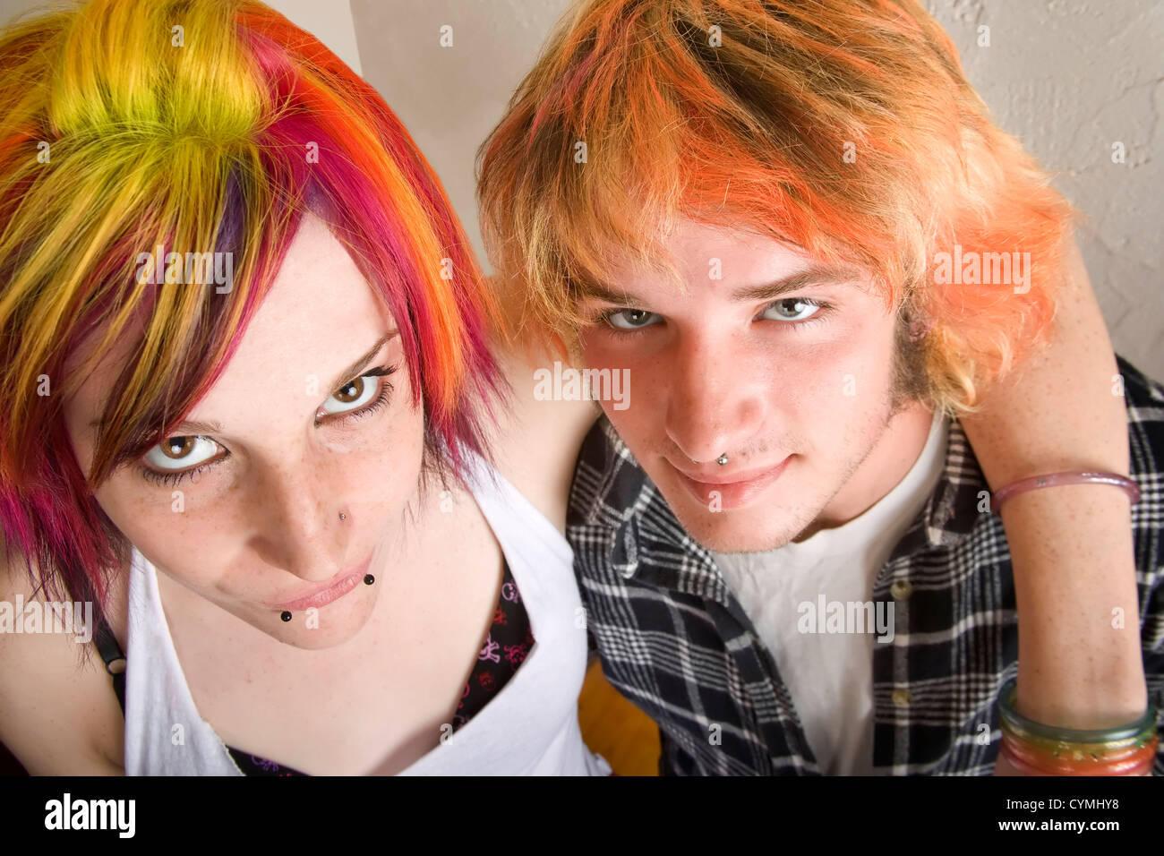 Portrait of Young Couple with Bright Colored Hair Embracing Stock Photo