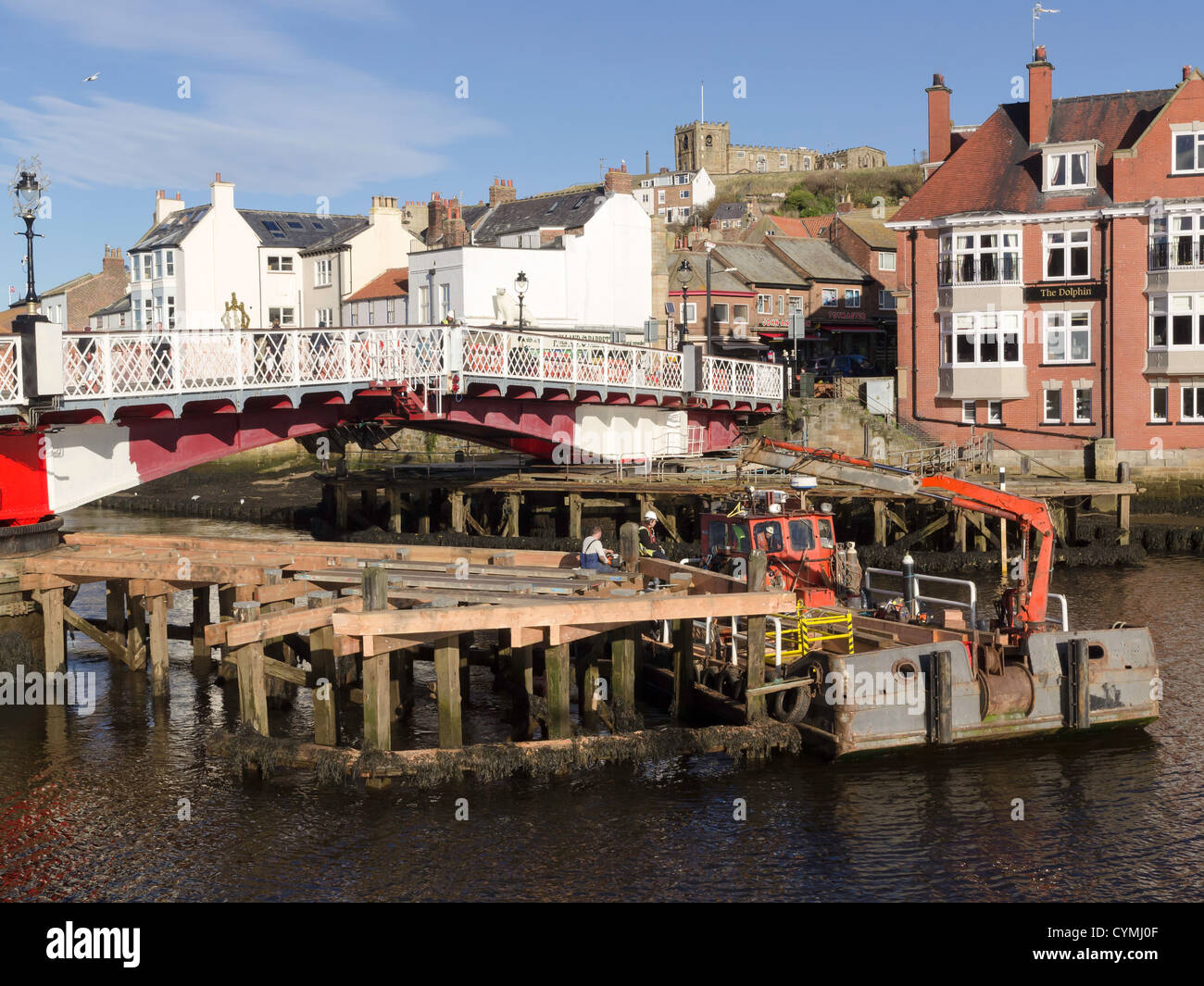 Refurbishment and painting of the Whitby swing bridge and fitting of new timber fenders for protection from ship collision Stock Photo