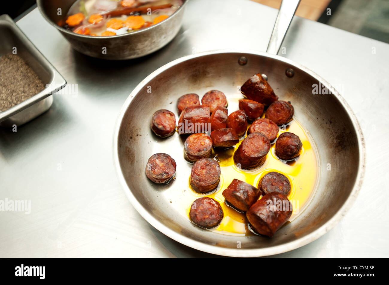 Sauteed chorizo sausage in a frying pan Stock Photo Alamy