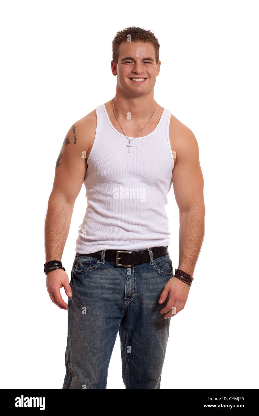 Casual young man in white undershirt and jeans. Stock Photo