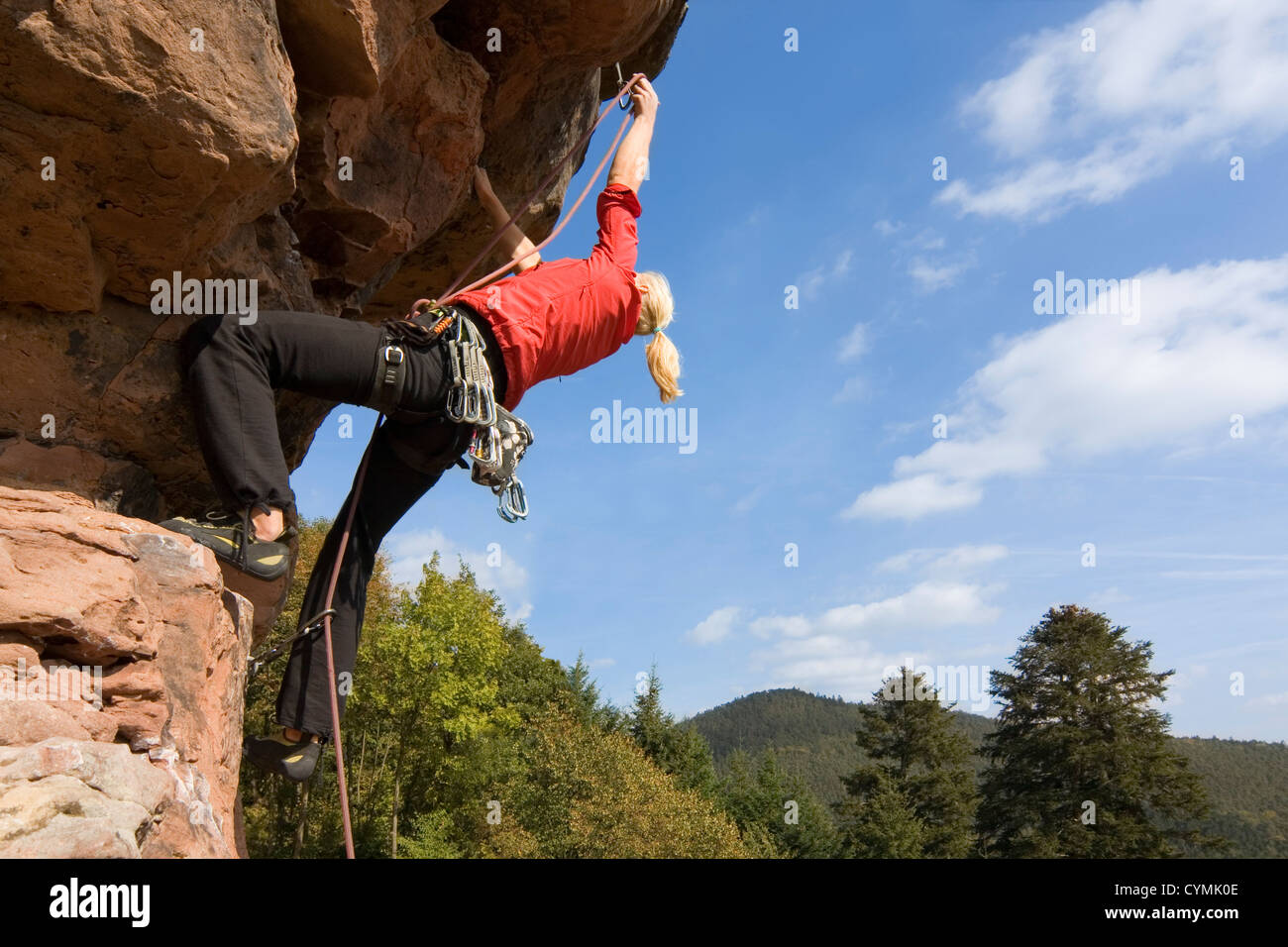 Rock climbing woman Stock Photo - Alamy