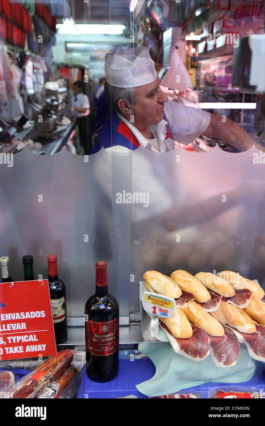 Butchers shop window, with butchers in view,  jamone ham sandwiches, Madrid, Spain Stock Photo