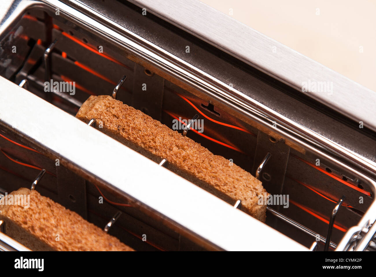two hot bread toast in metal toaster Stock Photo Alamy