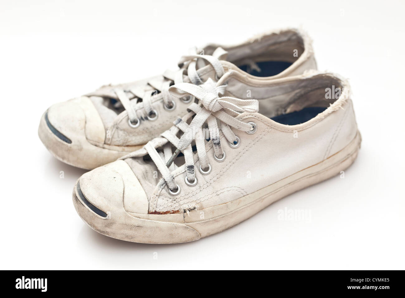 Old sport shoes on white background Stock Photo - Alamy