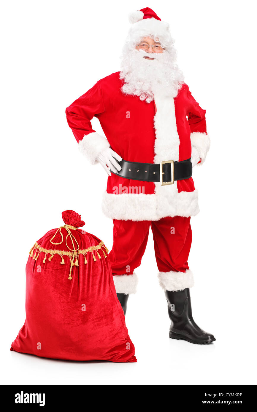 Full length portrait of a Santa Claus posing next to a bag isolated on ...