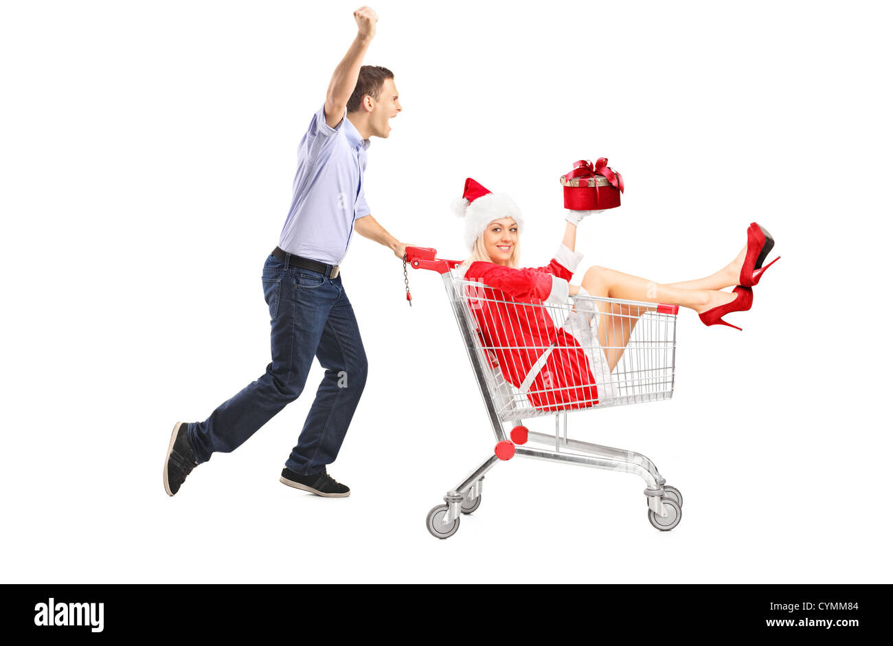 Happy guy pushing a female with gift in a shopping cart isolated on