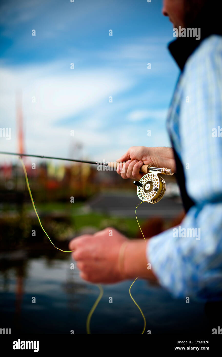 A man practices his fly fishing outside the Orvis store in Bend, Oregon