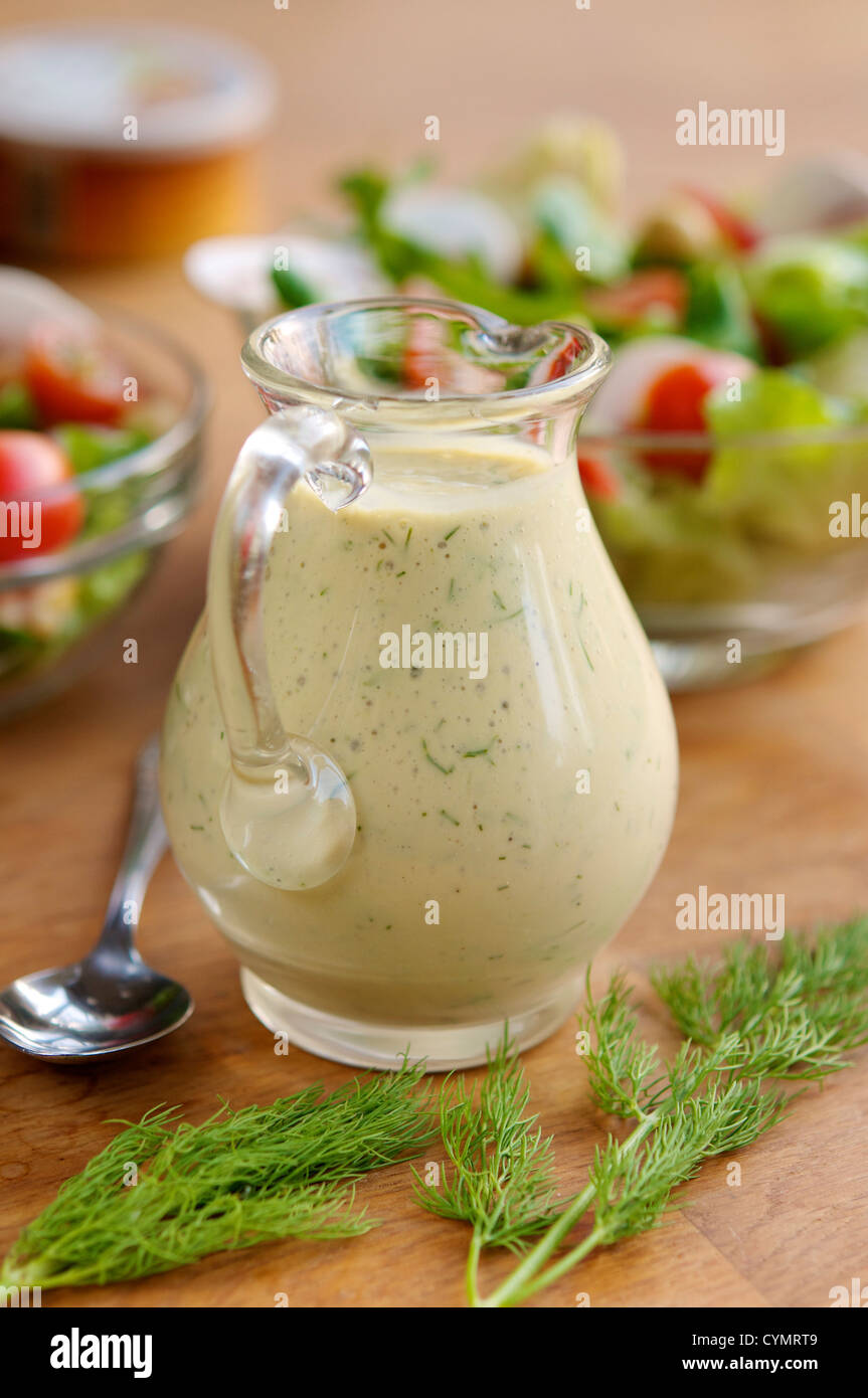 A creamy mustard dill dressing for a mixed salad or as sauce on a sandwich. Stock Photo