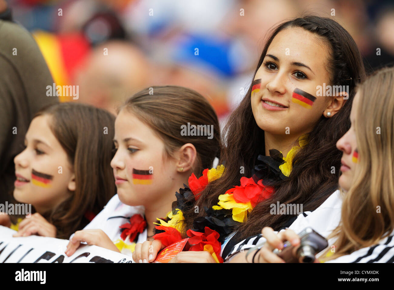 Young Germany supporters enjoy themselves in the stands at the 2011 Women's World Cup Group A match between Germany and Nigeria. Stock Photo