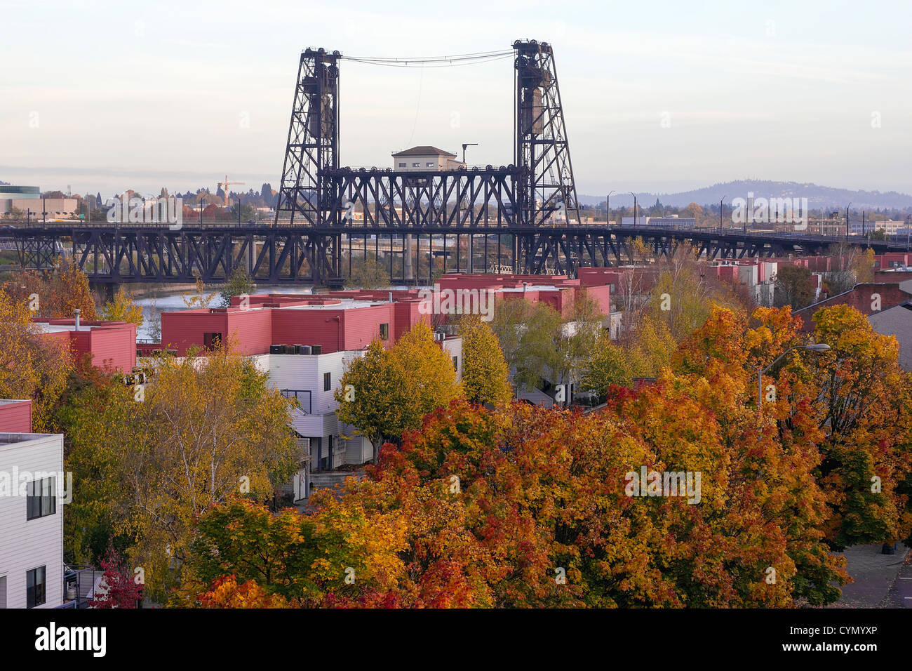 Steel Bridge Over Willamette River with Fall Color Trees in Portland Oregon Stock Photo