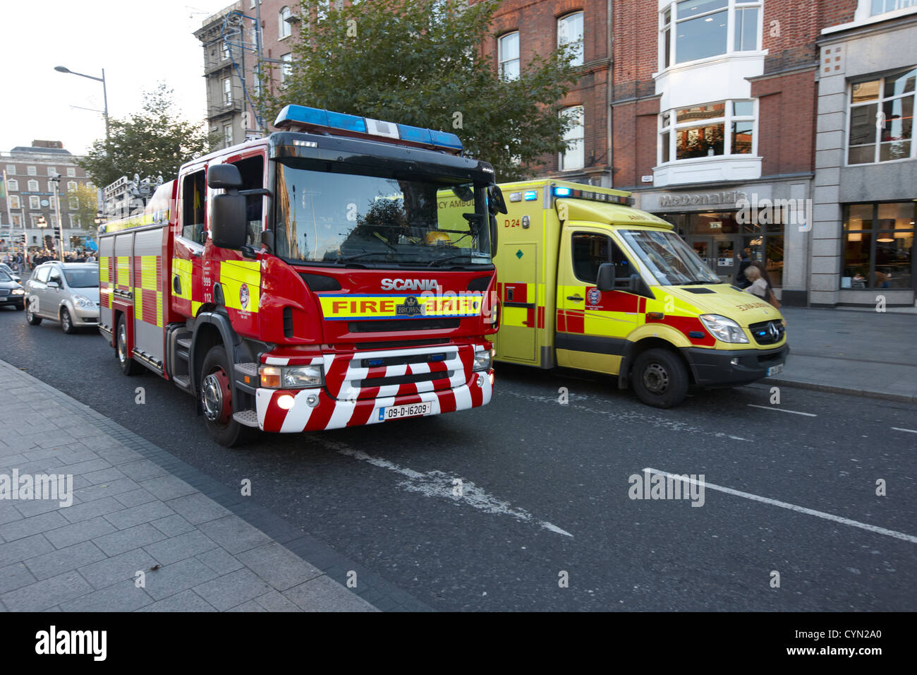 dublin fire brigade engine and emergency ambulance on call out oconnell street dublin republic of ireland Stock Photo