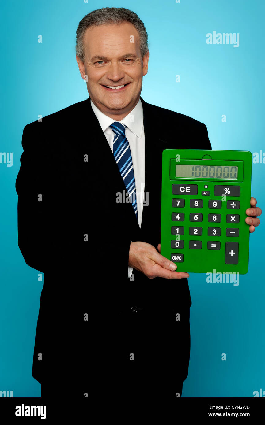 Manager Using Calculator Senior manager showing big green calculator isolated against gradient ...