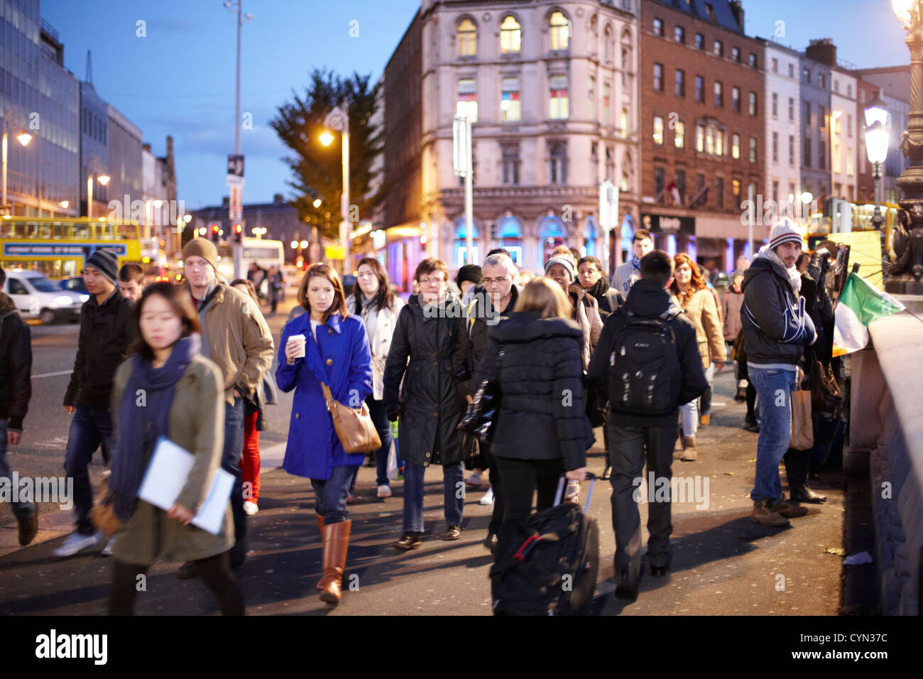 crowd of people crossing oconnell street bridge dublin republic of
