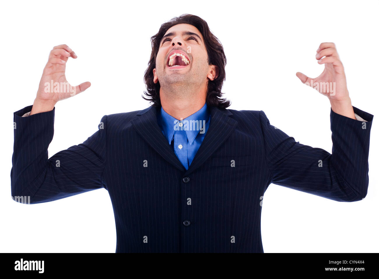 portrait of excited young business man with hands raised in white ...