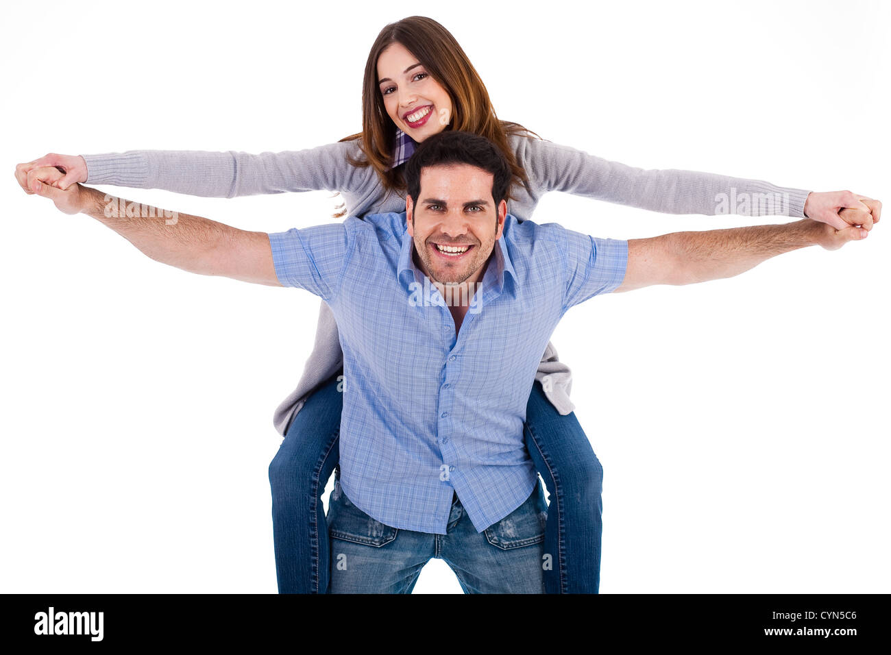 Front view of a couple in piggy back ride on a white isoalted ...